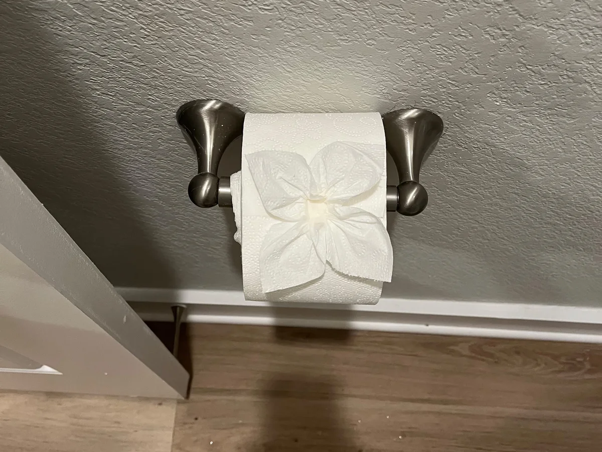 Bathroom left clean with a neatly folded towel