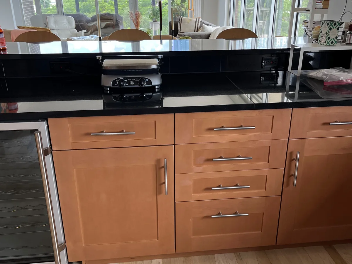 Clean kitchen with wood cabinets and hardwood floor
